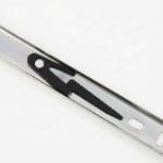 Detailed view of drawer slide lever disconnect for impact absorption and stability